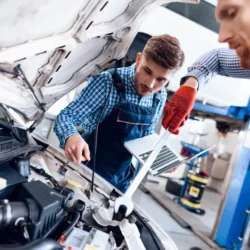 young-auto-mechanic-repairs-car-with-wrench