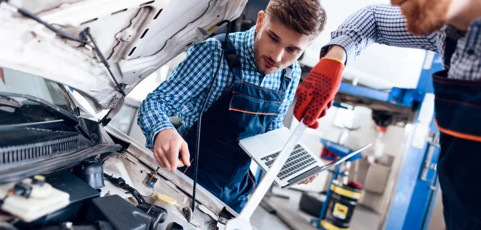 young-auto-mechanic-repairs-car-with-wrench