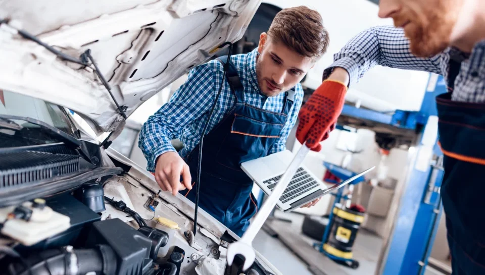 young-auto-mechanic-repairs-car-with-wrench